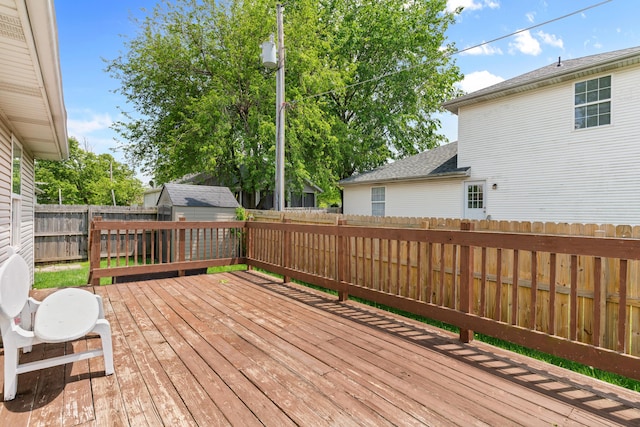 wooden deck featuring a fenced backyard