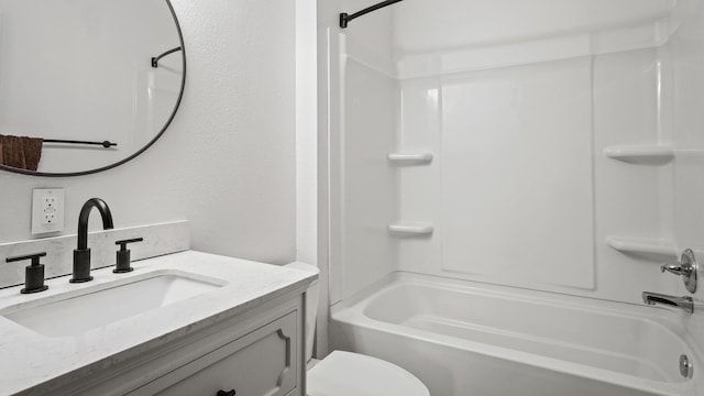 bathroom with toilet, vanity, and bathtub / shower combination