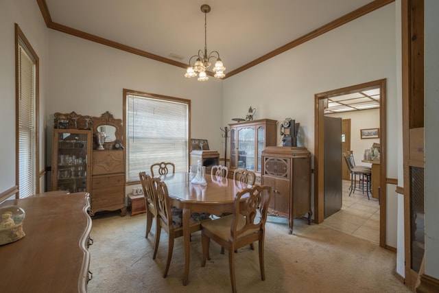 dining area with a wealth of natural light, ornamental molding, an inviting chandelier, and light colored carpet