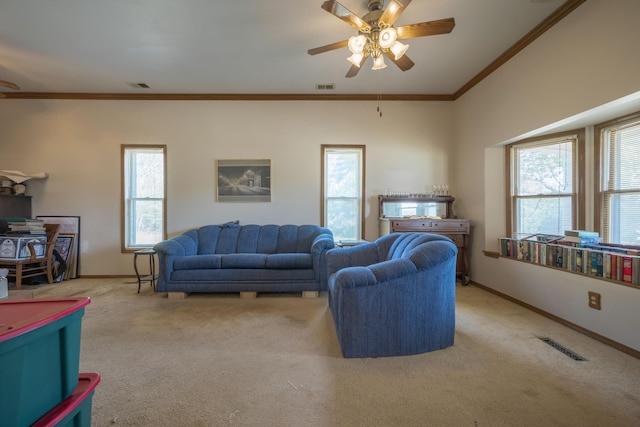 living room with a ceiling fan, a wealth of natural light, and light colored carpet