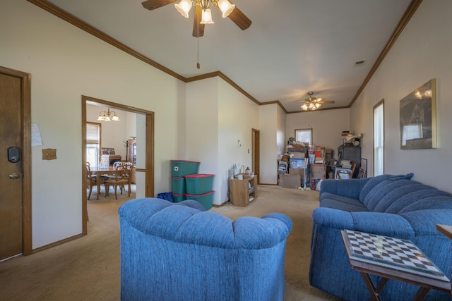 carpeted living room featuring crown molding, ceiling fan with notable chandelier, baseboards, and visible vents