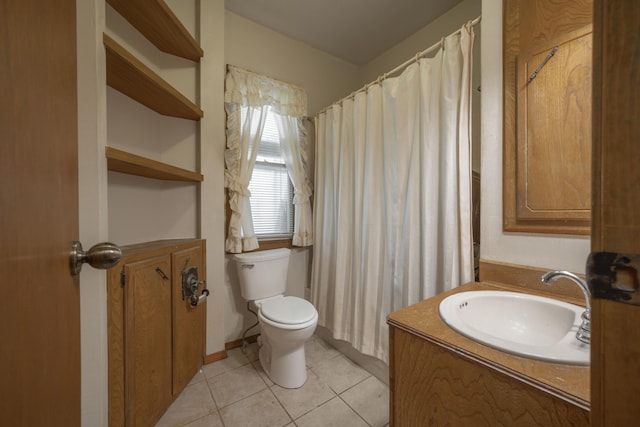 full bathroom featuring curtained shower, vanity, toilet, and tile patterned flooring