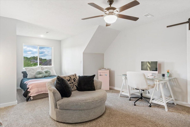 carpeted home office with baseboards, ceiling fan, visible vents, and a barn door