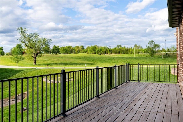 wooden deck with a lawn