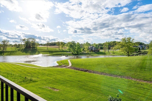 view of community featuring a water view and a lawn