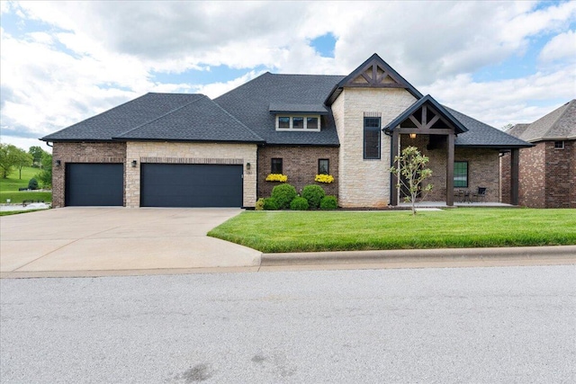 view of front of property with concrete driveway, an attached garage, brick siding, and a front yard