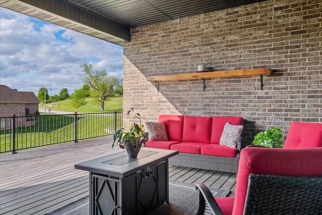 wooden deck featuring an outdoor hangout area