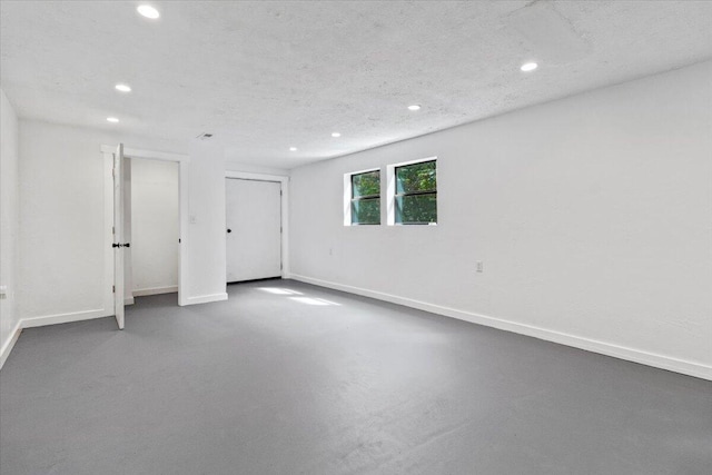 interior space featuring baseboards and recessed lighting