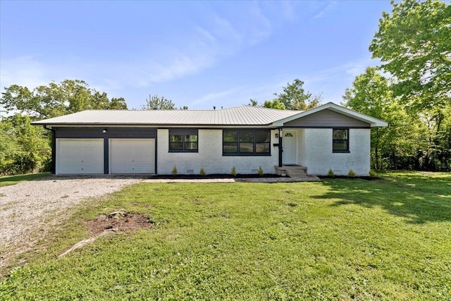 ranch-style house with gravel driveway, a front lawn, brick siding, and an attached garage