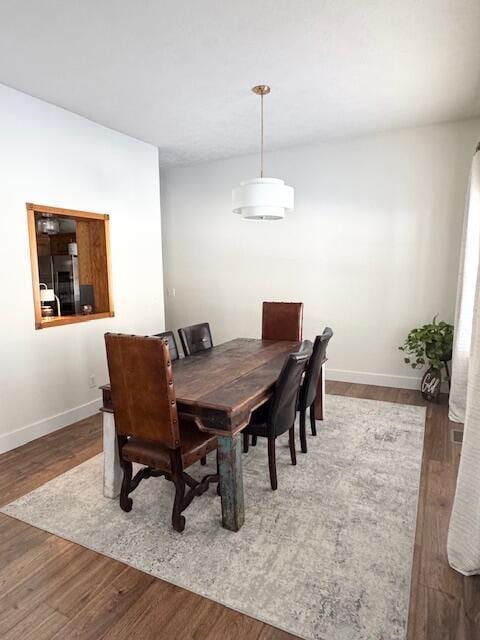 1118 E Ritter St, Republic, MO 65738 - dining space featuring baseboards and wood finished floors