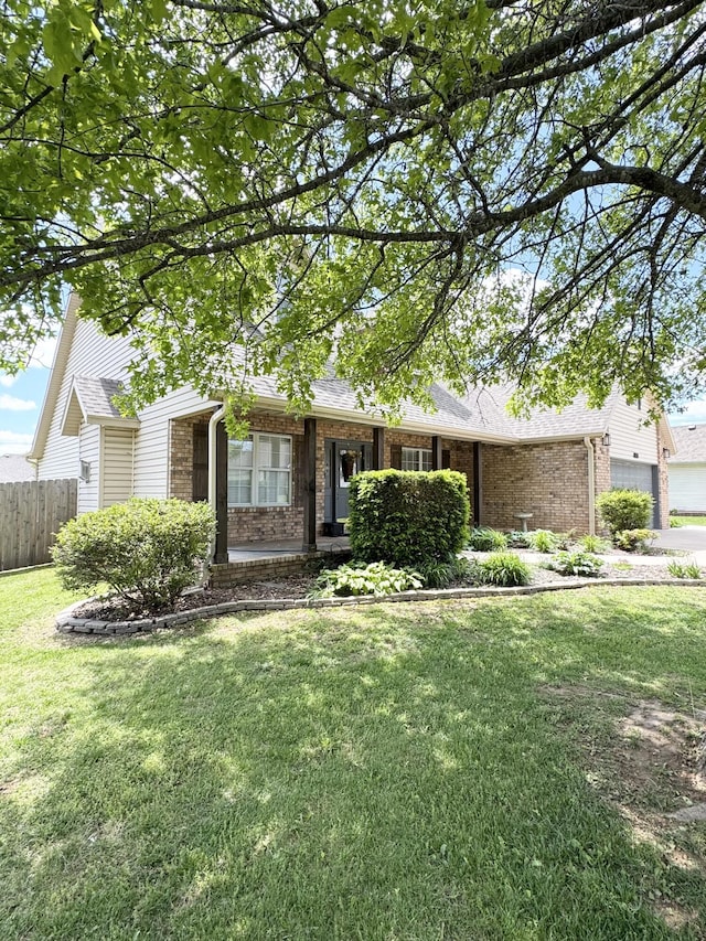 1118 E Ritter St, Republic, MO 65738 - ranch-style home featuring a front lawn, brick siding, fence, and a garage