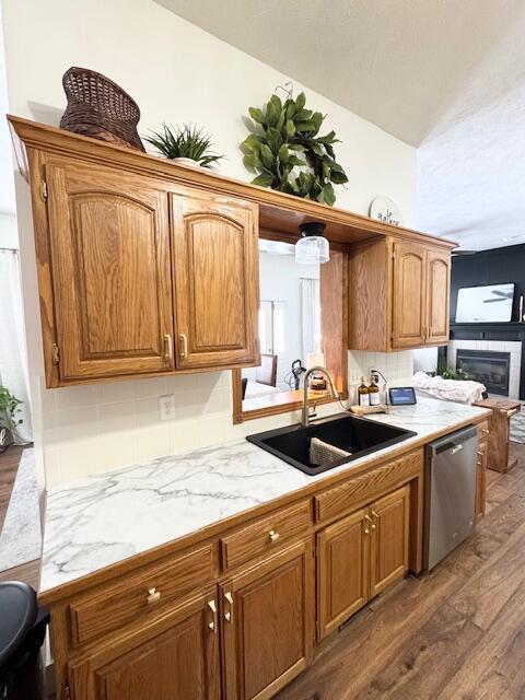 1118 E Ritter St, Republic, MO 65738 - kitchen with a sink, brown cabinets, wood finished floors, and dishwasher