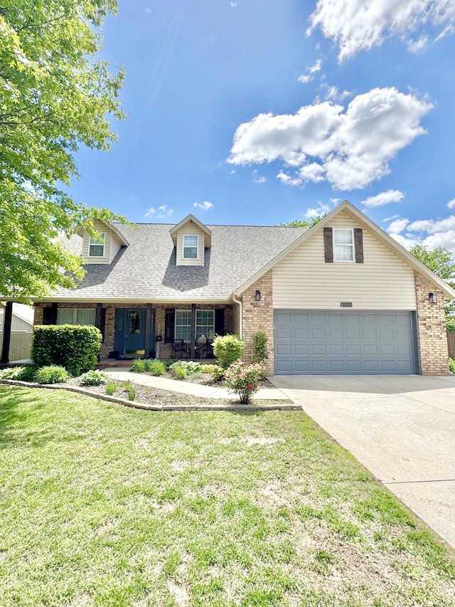 1118 E Ritter St, Republic, MO 65738 - view of front facade with driveway, brick siding, a front yard, a porch, and roof with shingles