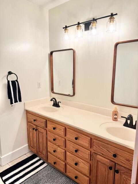 1118 E Ritter St, Republic, MO 65738 - full bath featuring a sink, double vanity, baseboards, and tile patterned flooring