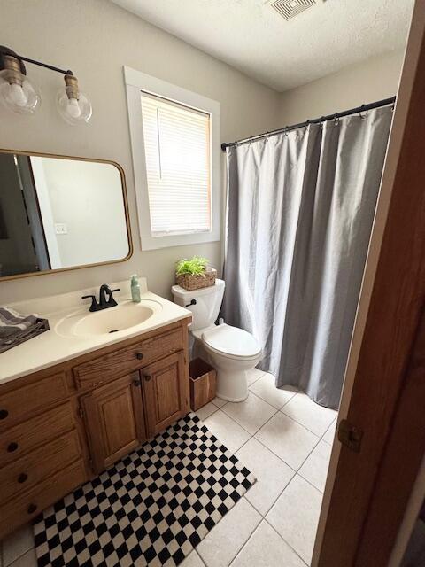1118 E Ritter St, Republic, MO 65738 - full bath featuring vanity, toilet, visible vents, and tile patterned floors