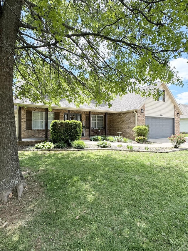 1118 E Ritter St, Republic, MO 65738 - single story home with a garage, a front lawn, brick siding, and driveway