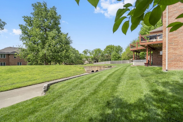 view of yard with a wooden deck