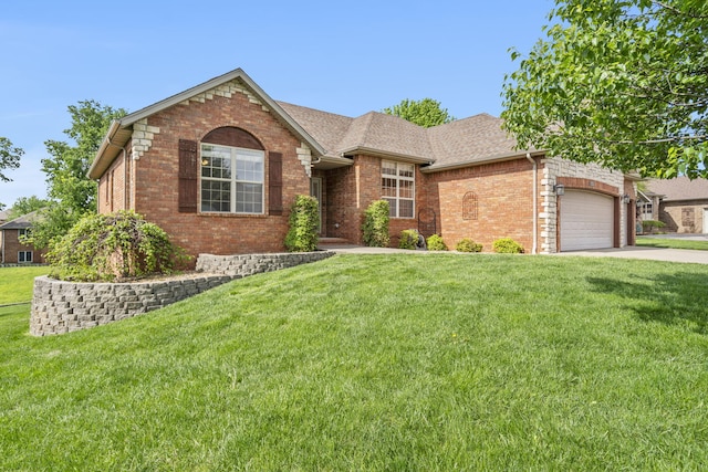 ranch-style house with an attached garage, concrete driveway, a shingled roof, a front yard, and brick siding