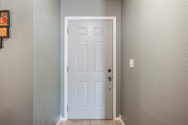 doorway with baseboards