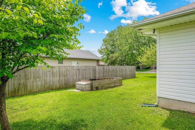 view of yard featuring a garden and fence