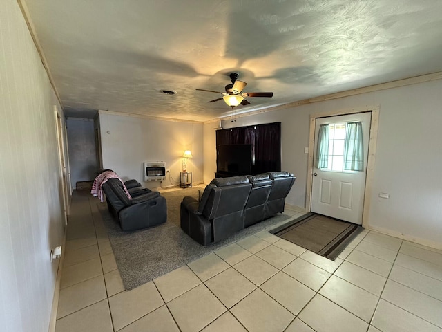 1398 County Road 670, Birch Tree, MO 65438 - living room with ceiling fan, heating unit, crown molding, and light tile patterned floors