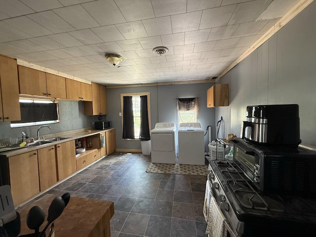 1398 County Road 670, Birch Tree, MO 65438 - kitchen with a sink, brown cabinets, black microwave, and washer and dryer