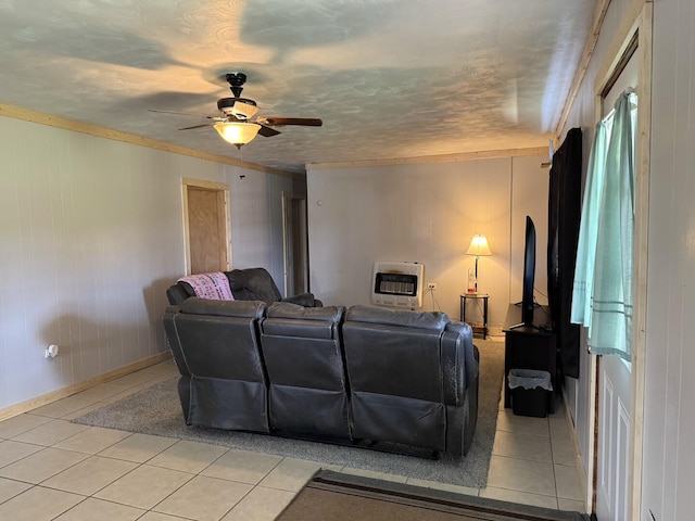 1398 County Road 670, Birch Tree, MO 65438 - living room featuring baseboards, ceiling fan, heating unit, and light tile patterned flooring