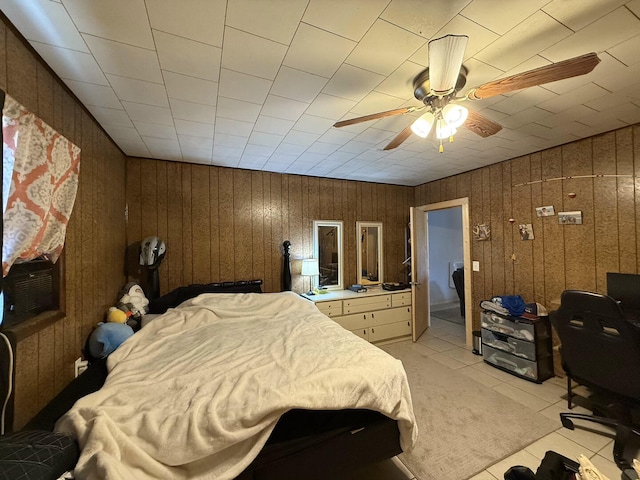 1398 County Road 670, Birch Tree, MO 65438 - bedroom featuring a ceiling fan, wooden walls, and light tile patterned flooring
