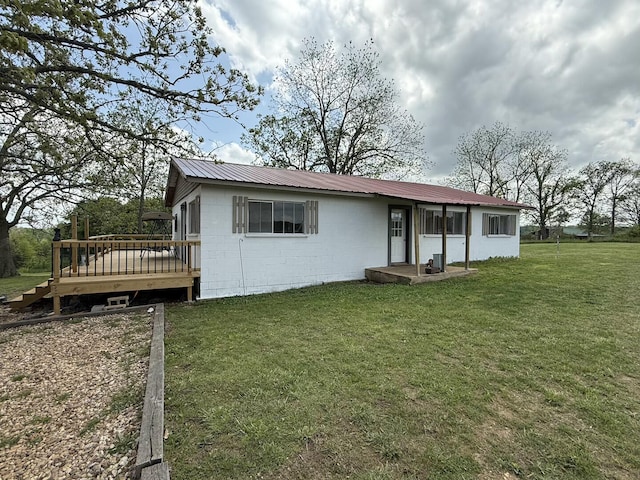 1398 County Road 670, Birch Tree, MO 65438 - rear view of house featuring a yard, a deck, concrete block siding, and metal roof