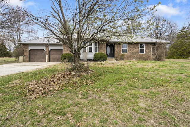single story home featuring concrete driveway, metal roof, brick siding, and an attached garage