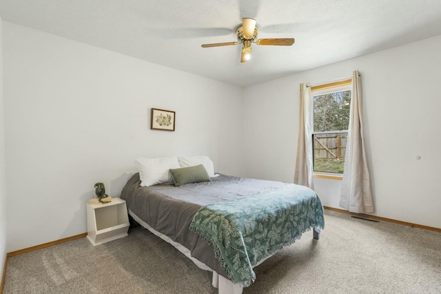 bedroom with baseboards, visible vents, and carpet floors