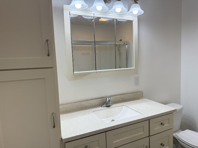 bathroom with toilet and vanity