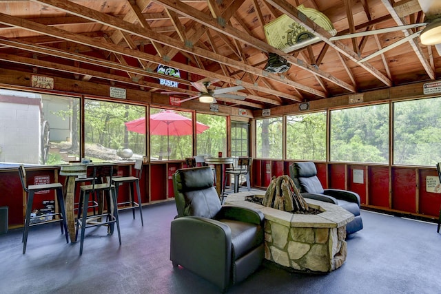 sunroom with ceiling fan and outdoor dry bar