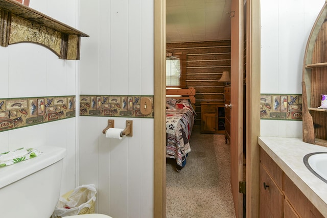 bathroom with toilet and vanity