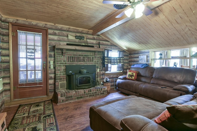 living area featuring a wood stove, log walls, wood-type flooring, a ceiling fan, and wood ceiling