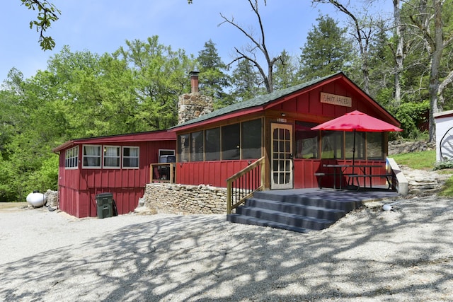 chalet / cabin featuring a chimney