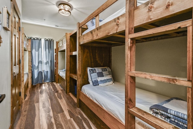 bedroom featuring dark wood-type flooring