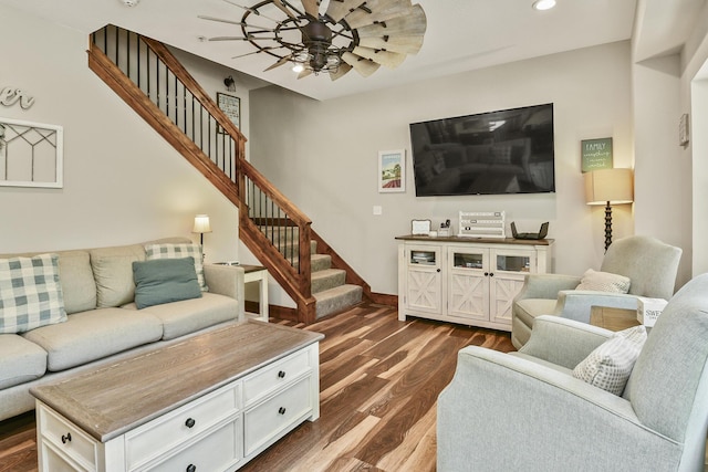 living room featuring dark wood-type flooring, recessed lighting, stairway, ceiling fan, and baseboards