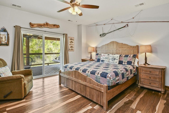 bedroom with visible vents, wood finished floors, and access to exterior