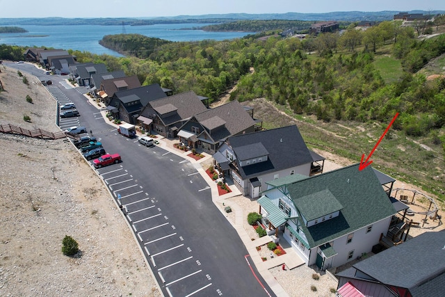 birds eye view of property featuring a water view and a residential view