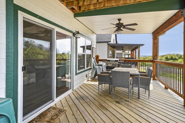 deck with ceiling fan and outdoor dining space