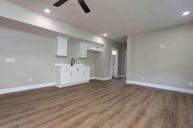 385 Plumtree Dr, Ozark, MO 65721 - interior space featuring a sink, light wood-type flooring, recessed lighting, ceiling fan, and baseboards