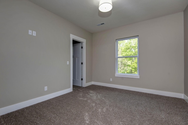 385 Plumtree Dr, Ozark, MO 65721 - unfurnished room with visible vents, baseboards, and dark carpet