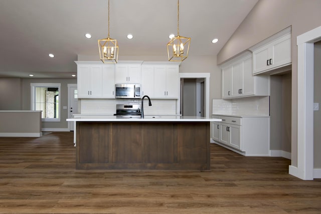 385 Plumtree Dr, Ozark, MO 65721 - kitchen featuring stainless steel appliances, an inviting chandelier, white cabinetry, light countertops, and baseboards