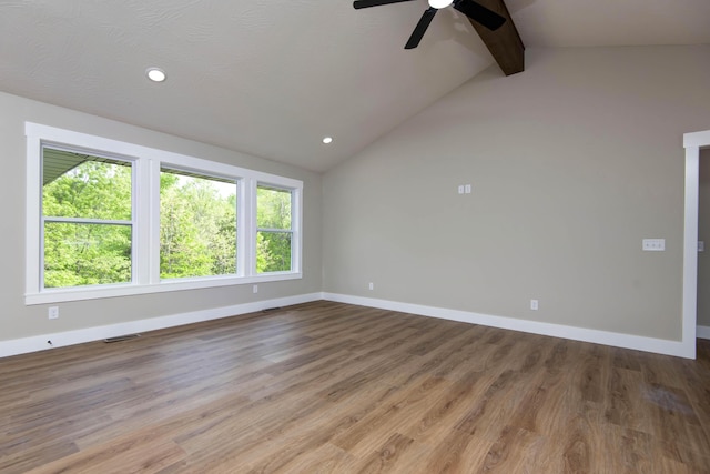 385 Plumtree Dr, Ozark, MO 65721 - empty room featuring ceiling fan, wood finished floors, baseboards, and vaulted ceiling with beams