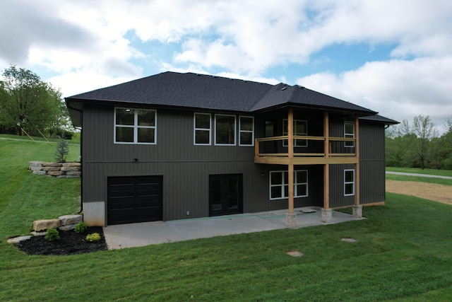 385 Plumtree Dr, Ozark, MO 65721 - rear view of house featuring an attached garage, a patio, a shingled roof, a balcony, and a yard