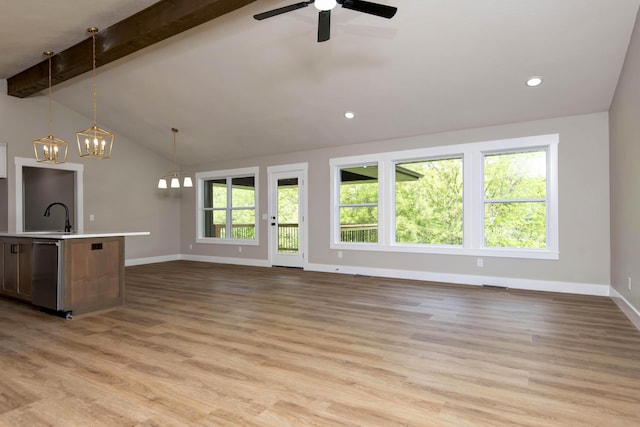 385 Plumtree Dr, Ozark, MO 65721 - unfurnished living room with baseboards, light wood-style floors, vaulted ceiling with beams, and ceiling fan with notable chandelier