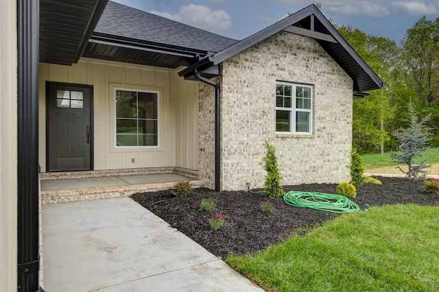 385 Plumtree Dr, Ozark, MO 65721 - view of exterior entry with brick siding and a shingled roof