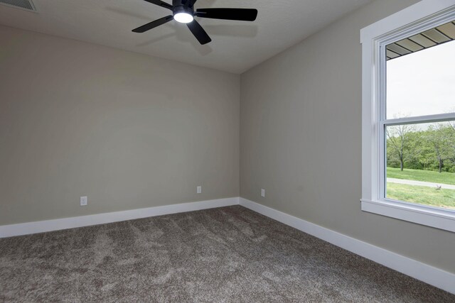 385 Plumtree Dr, Ozark, MO 65721 - empty room with dark colored carpet, baseboards, a ceiling fan, and visible vents
