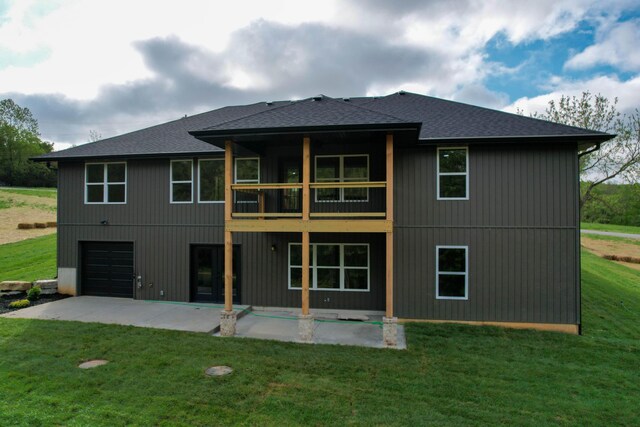 385 Plumtree Dr, Ozark, MO 65721 - back of house with a lawn, a balcony, a patio, a garage, and roof with shingles